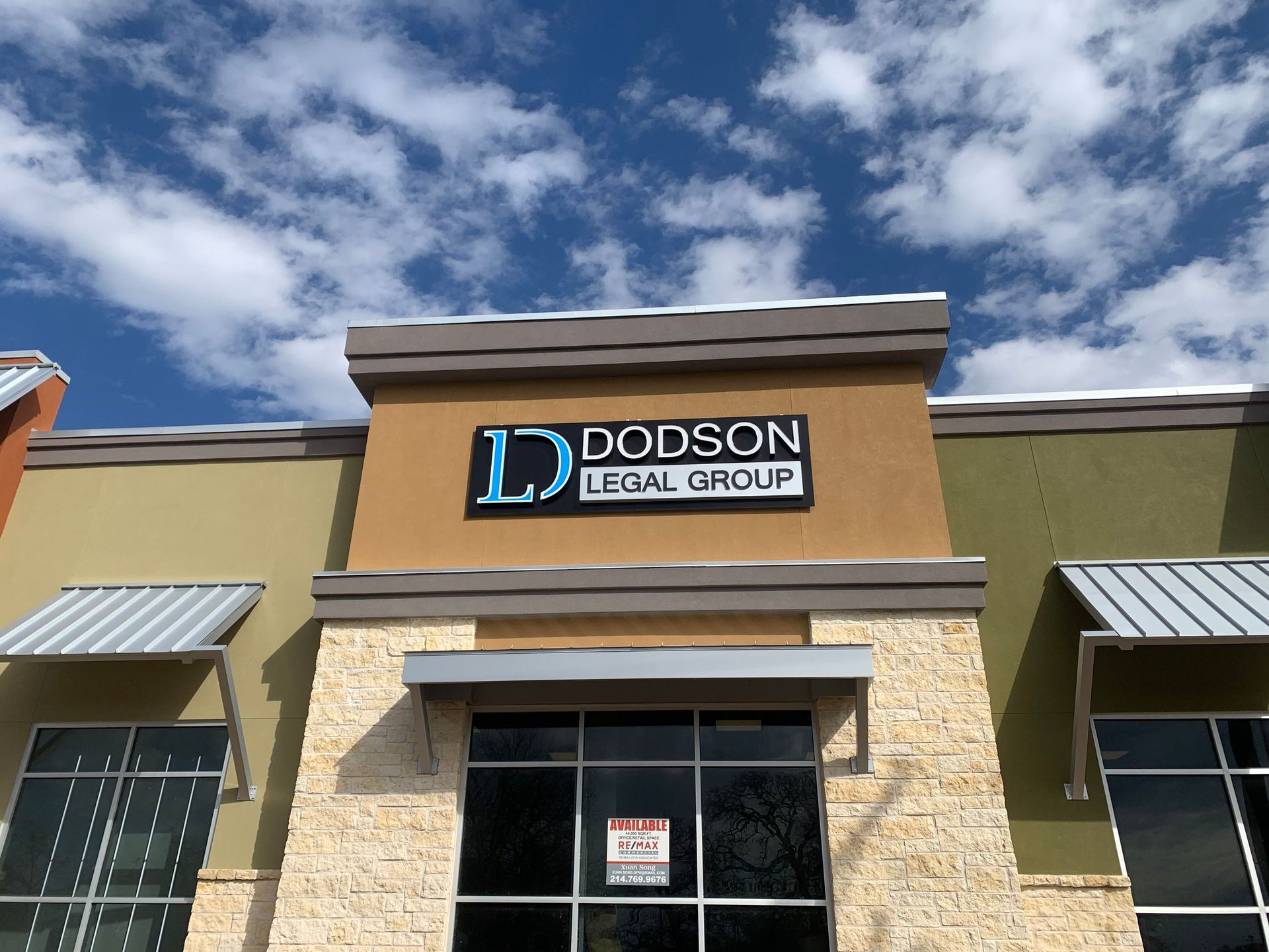 Exterior office sign for Dodson Legal Group in Denton, TX, featuring dimensional lettering and a blue branded logo.
