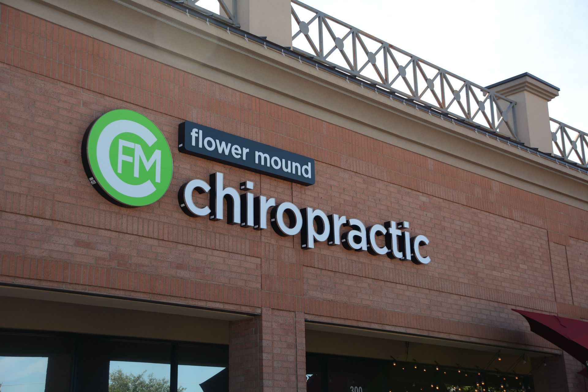 Illuminated channel letter sign and logo for Flower Mound Chiropractic in Flower Mound, TX.