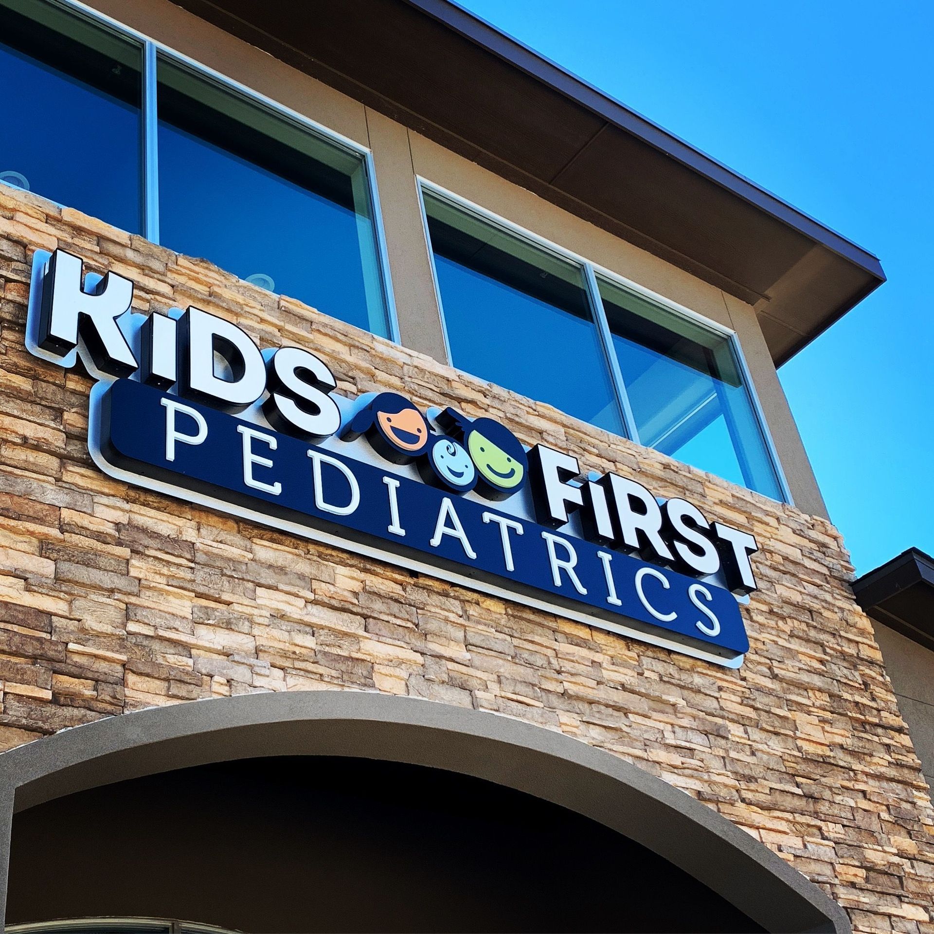 Illuminated channel letter sign for Kids First Pediatrics in Highland Village, TX.