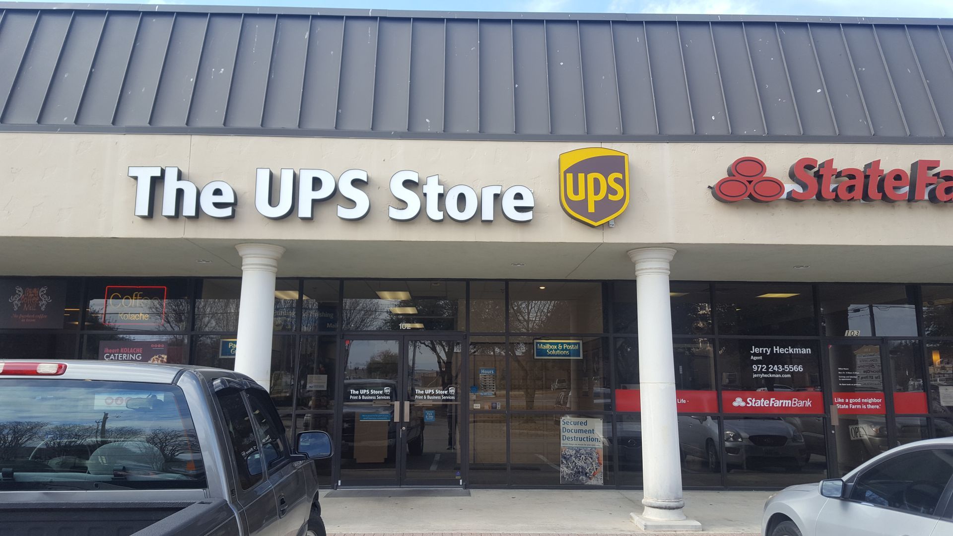 The UPS Store storefront with brown and gold logo, next to a State Farm office.