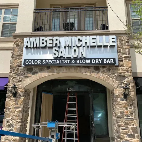 Salon storefront with sign 