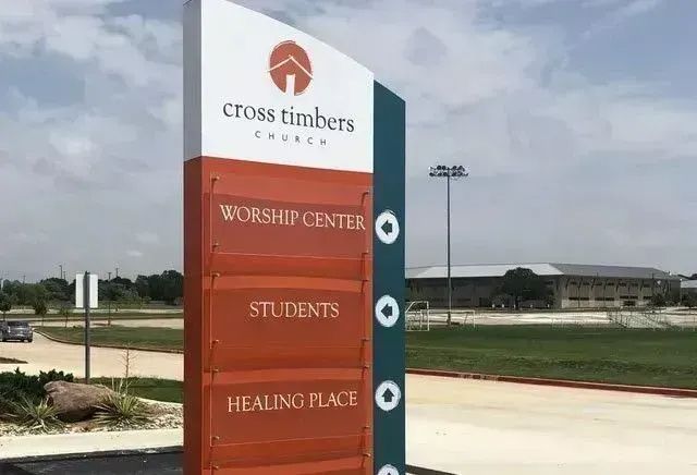 Cross Timbers Church sign listing Worship Center, Students, and Healing Place outdoors