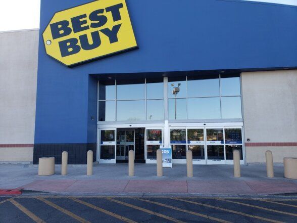 a Best Buy store with tinted windows and doors