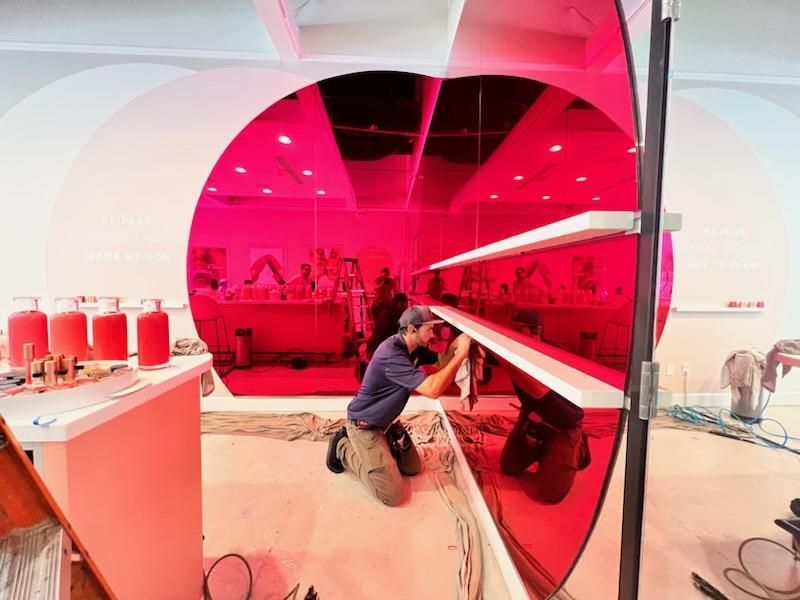 a man installing a red tint film