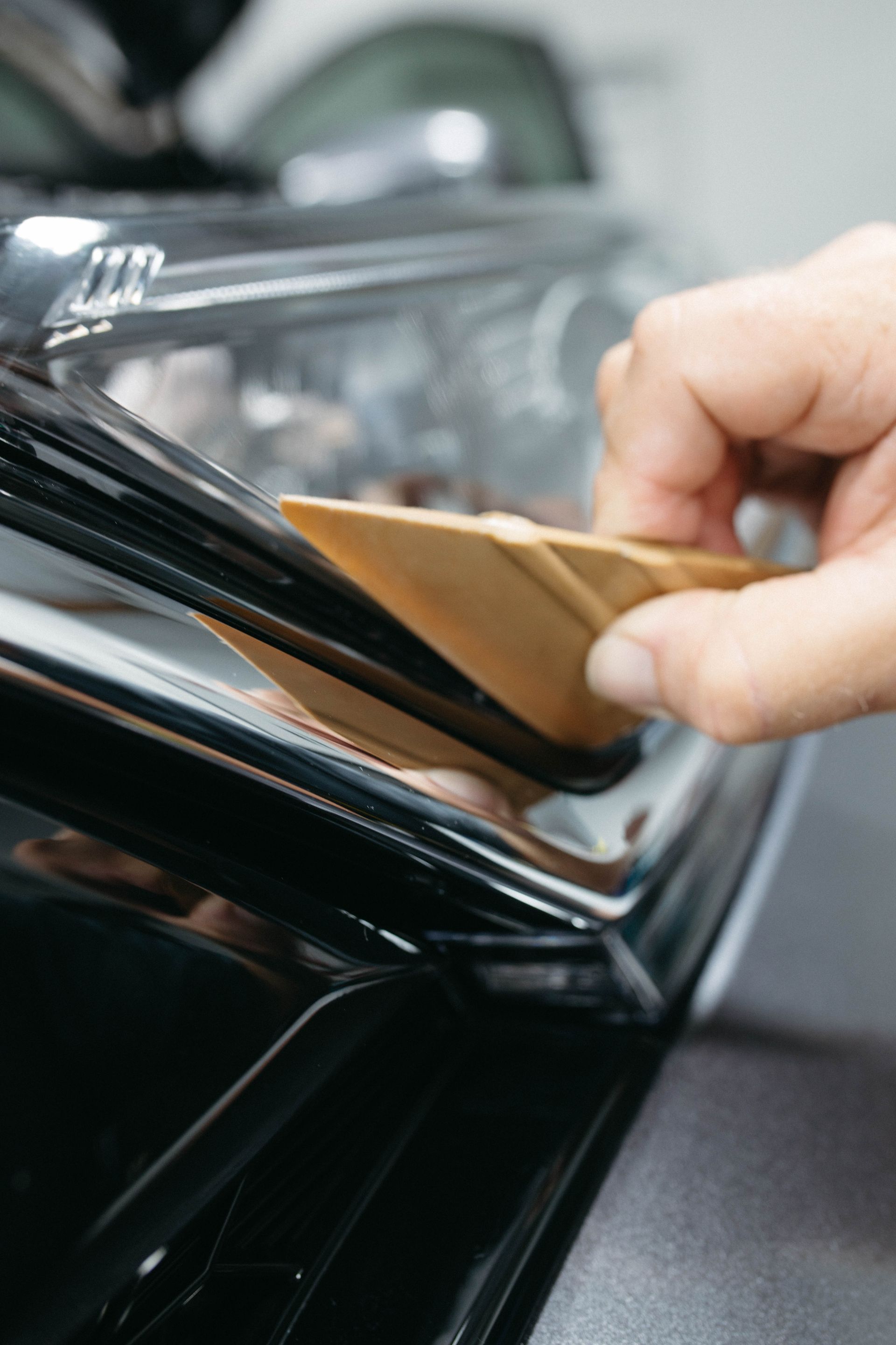 a person is fixing the edges of a protective film