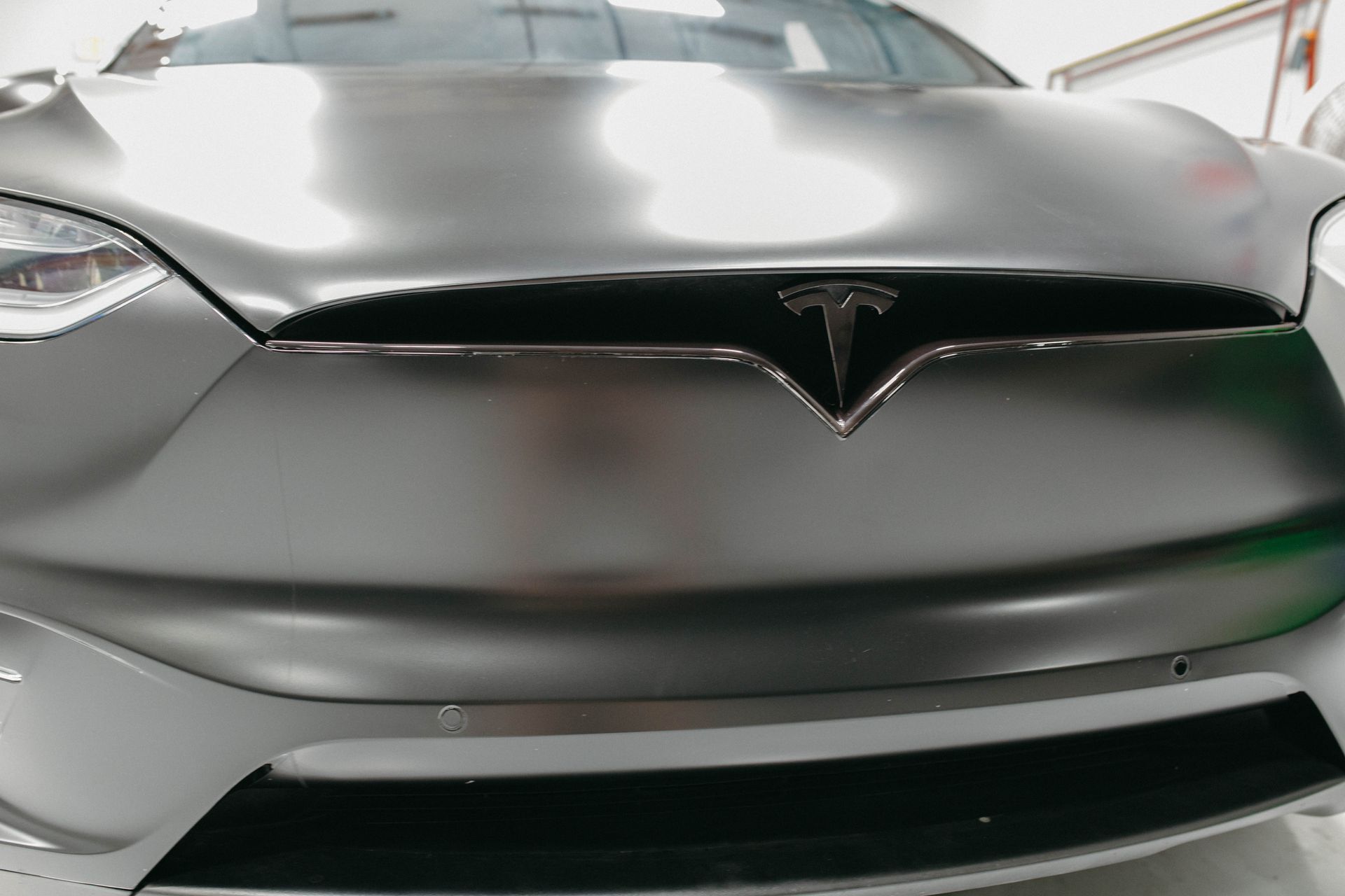 a close up of the front of a tesla