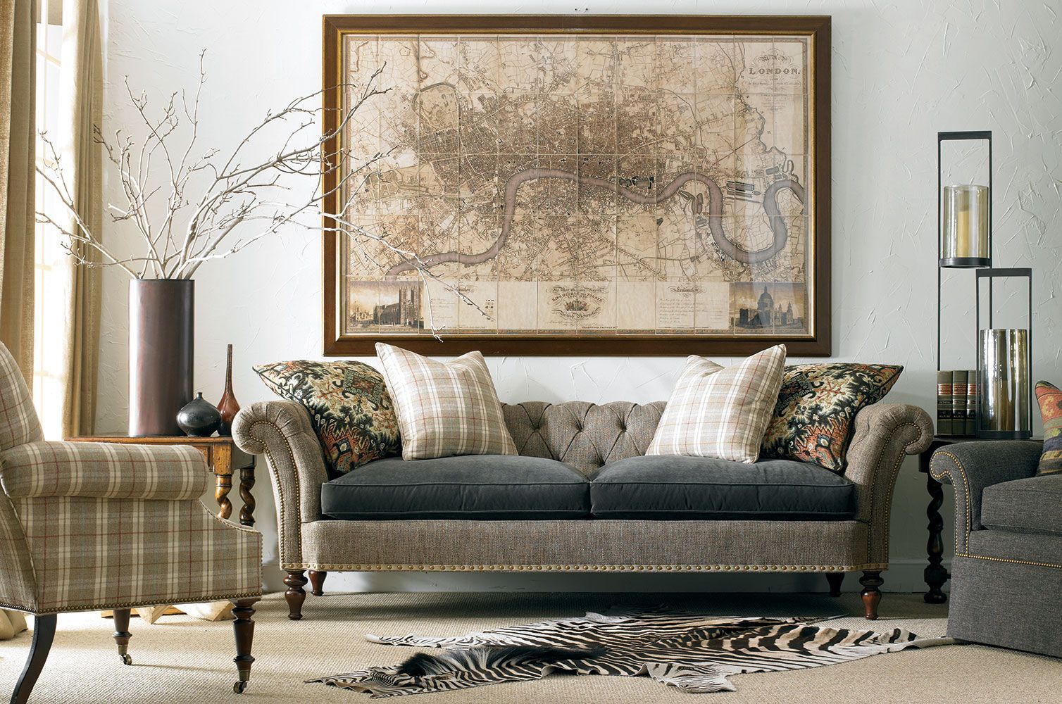 A living room with a large map on the wall above the couch