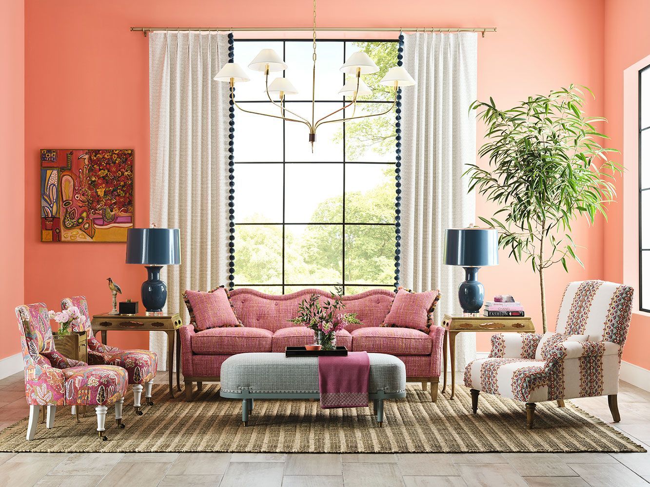 A living room with pink walls and pink furniture.