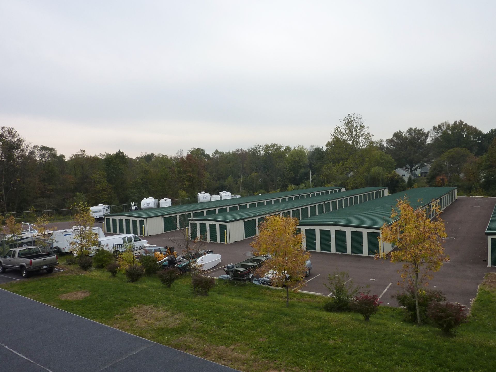 An aerial view of a storage facility with green roofs