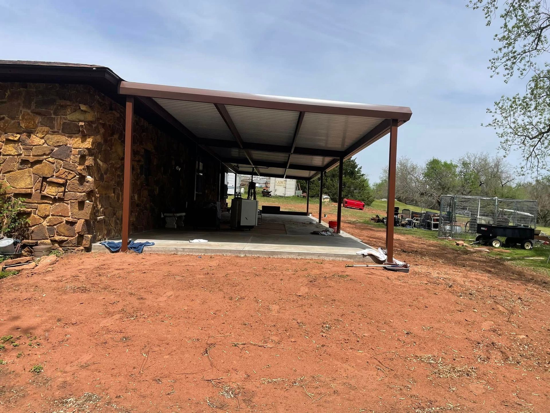 A house with a covered patio in front of it.