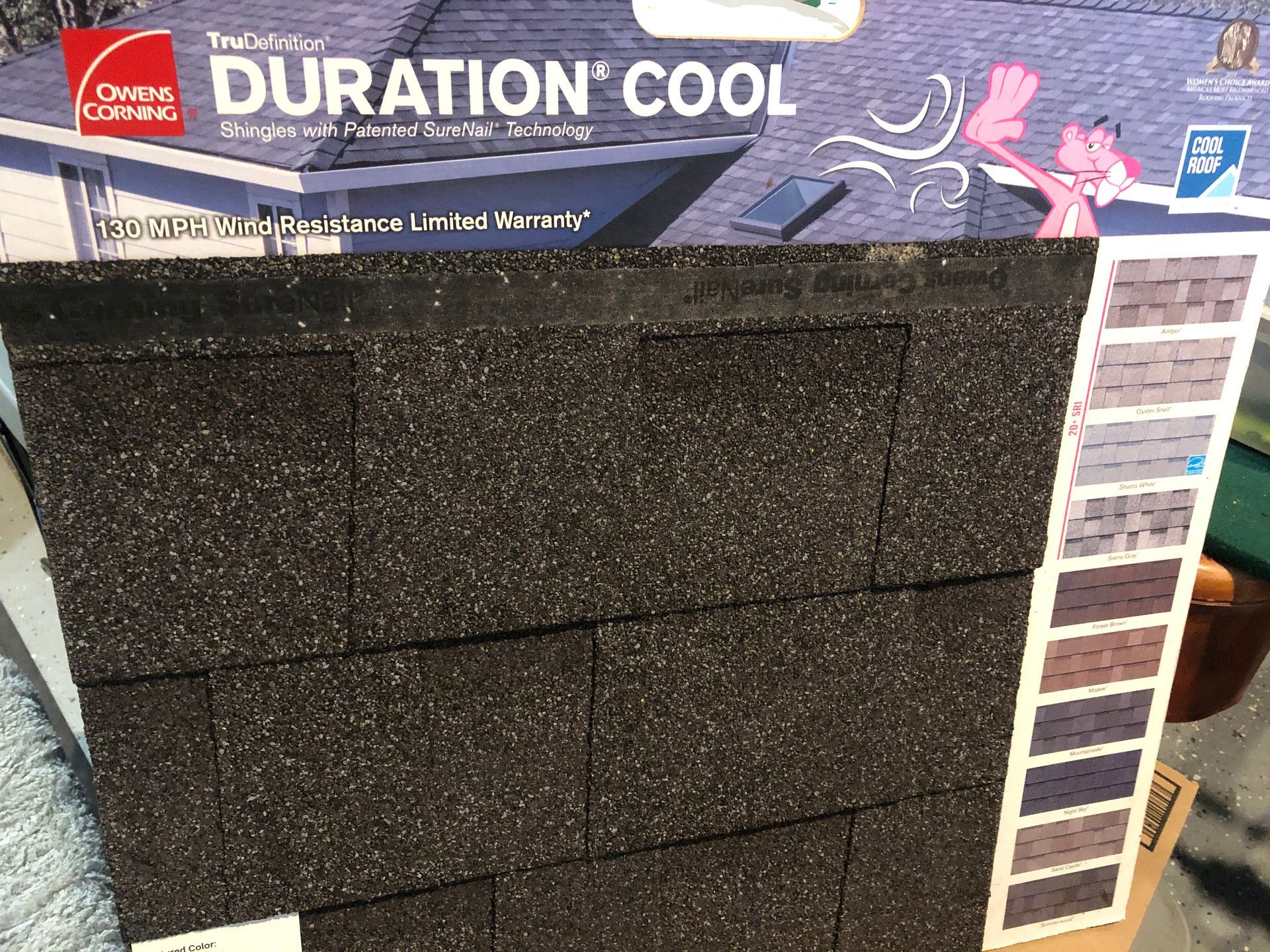 A box of duration cool shingles is sitting on a table.