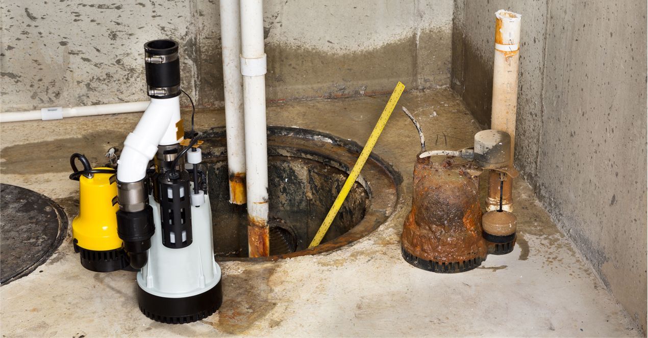 Basement utility area with exposed pipes, sump pump, and rusty tank on a concrete floor.