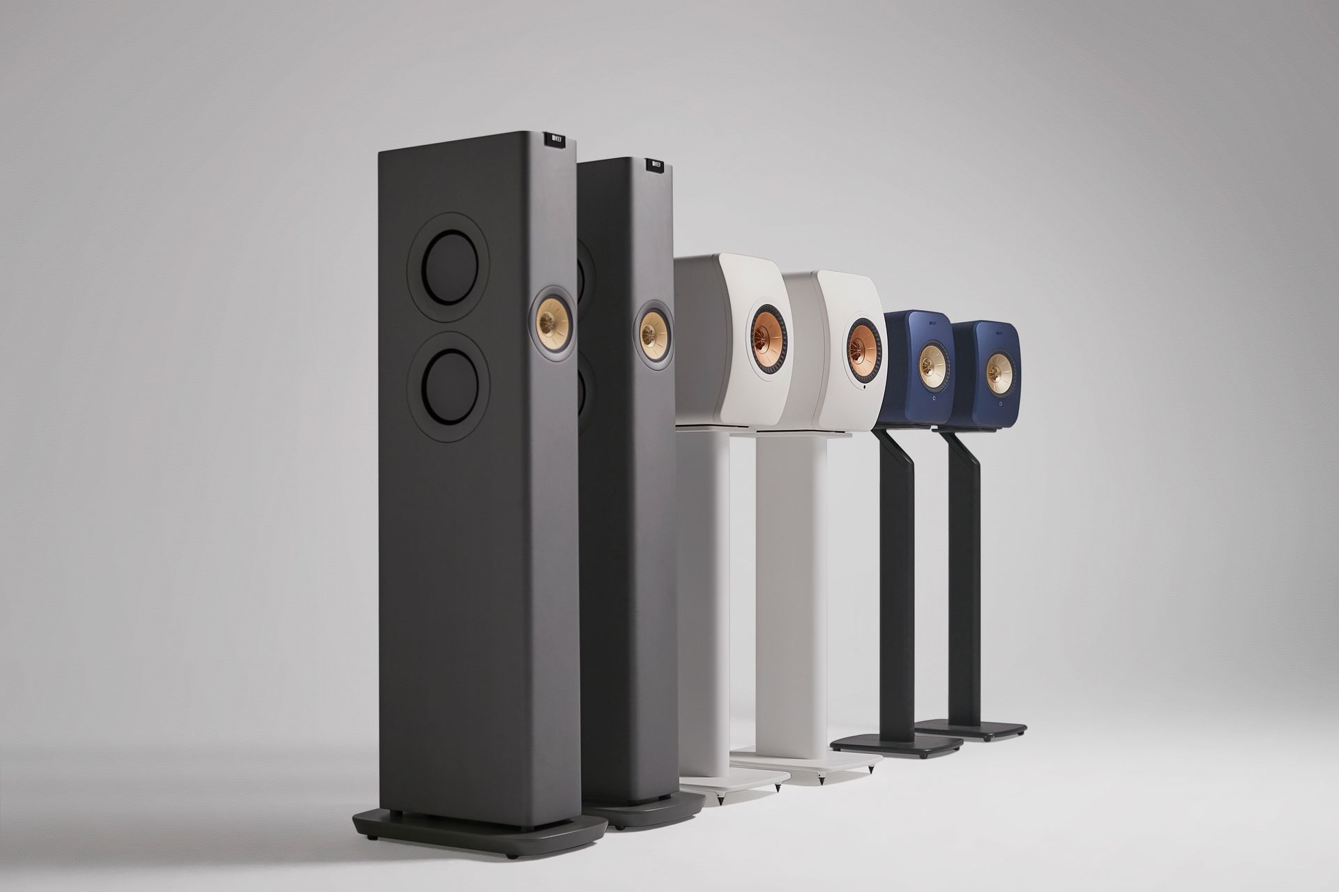 A room with a flat screen tv and speakers