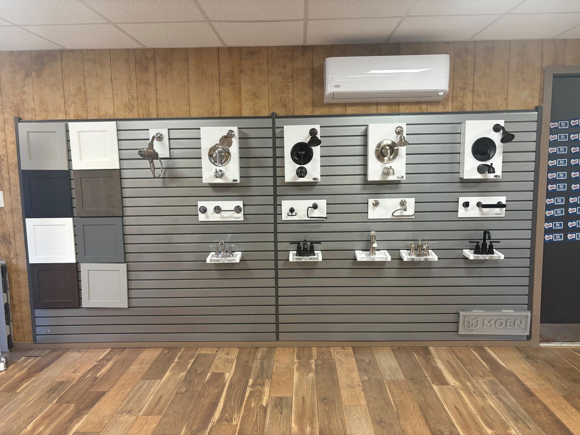 Retail display wall with mounted pet accessories, leashes, and shelves in a store interior