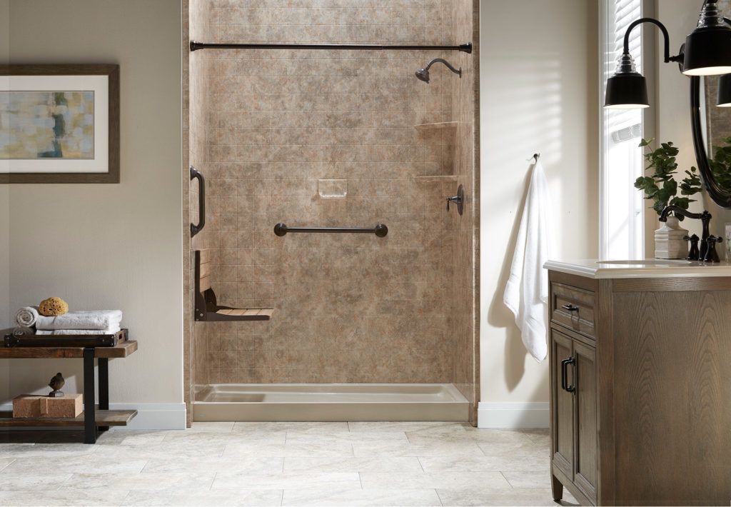 Modern bathroom with a large stone-textured shower door, light tile floor, and vanity.