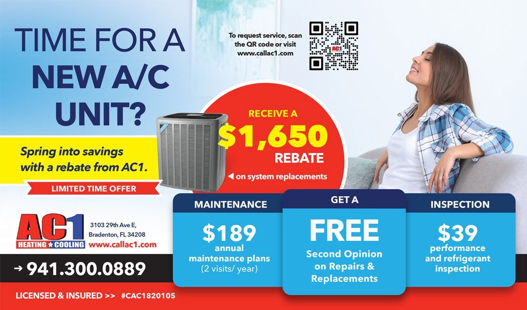 A woman is sitting on a couch in front of a new a/c unit.