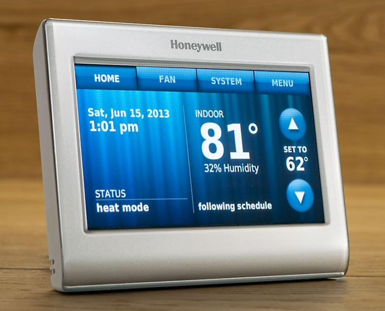 Honeywell digital thermostat displaying 81°F indoors and 62°F set temperature, in heat mode