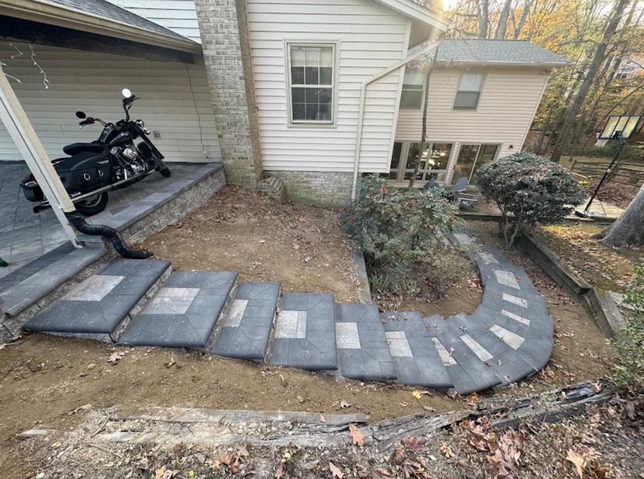 A motorcycle is parked on the porch of a house.