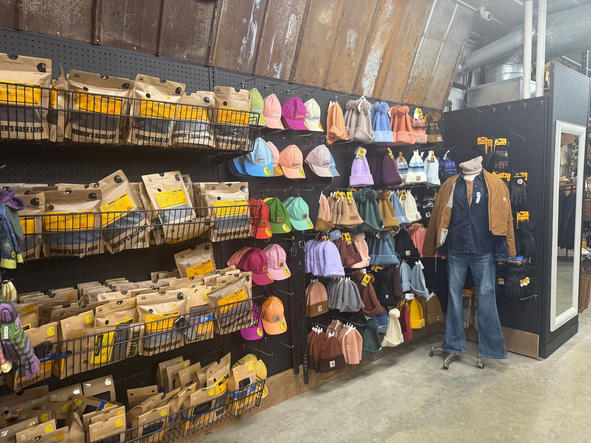 A store filled with lots of hats and jackets