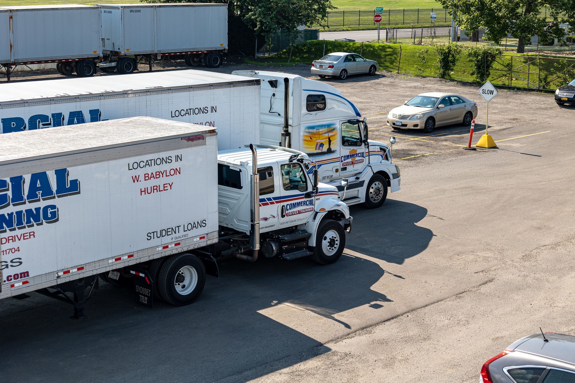Truck and trailer parked, labeled 