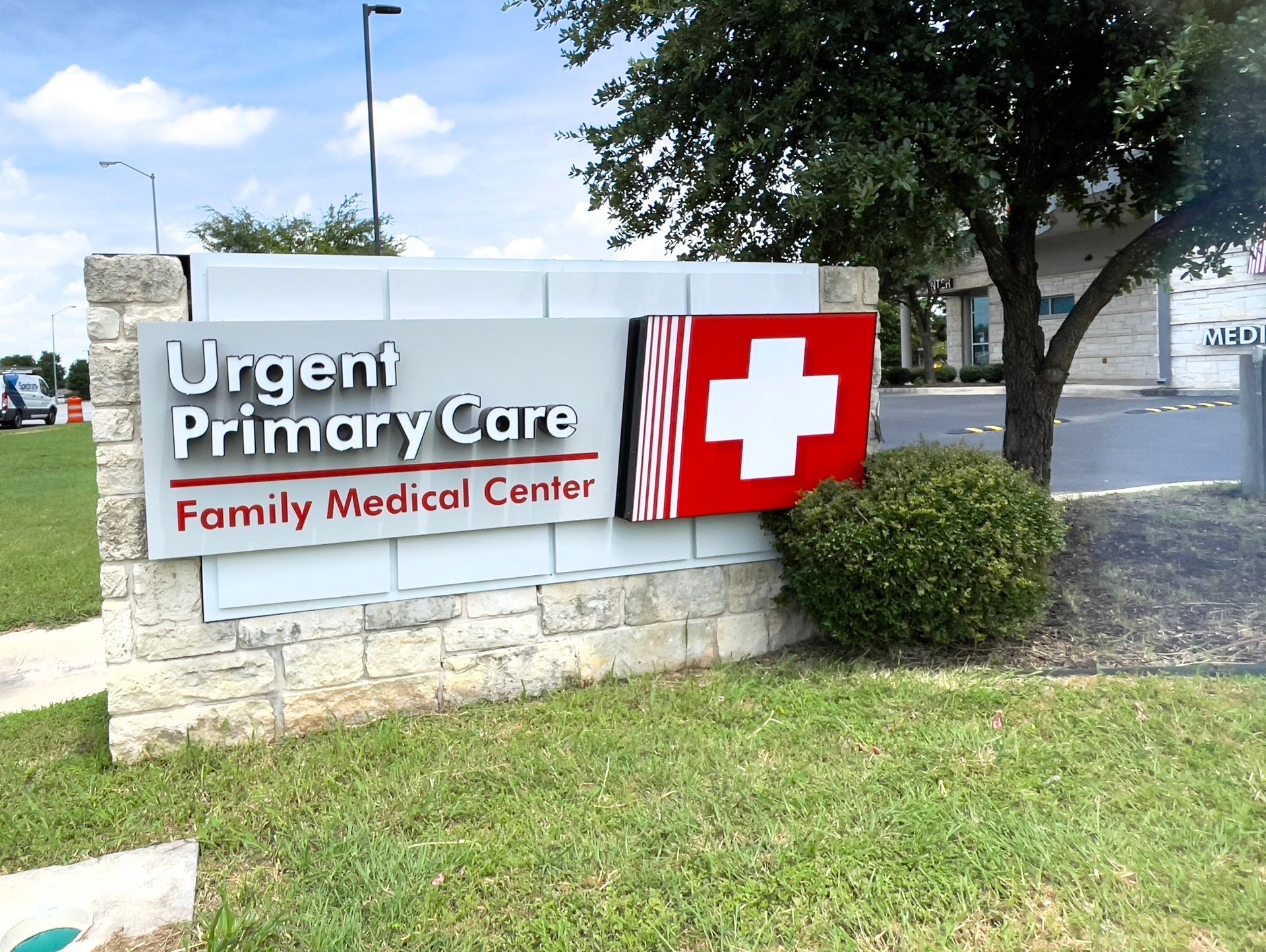 A nurse 's station in a hospital with wooden floors and cabinets.