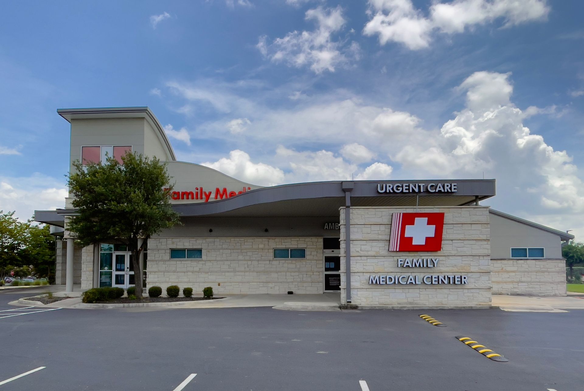 A large white building with palm trees in front of it