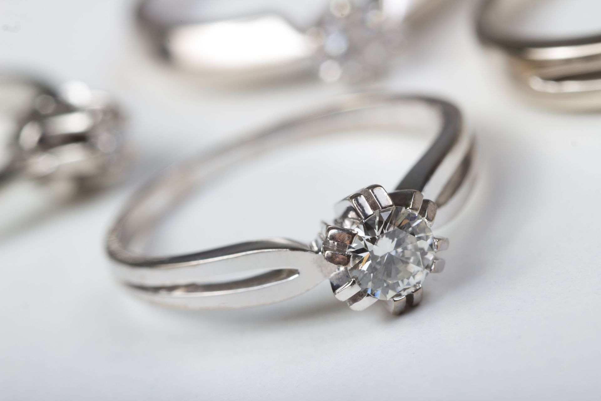 A silver ring with a diamond in the center