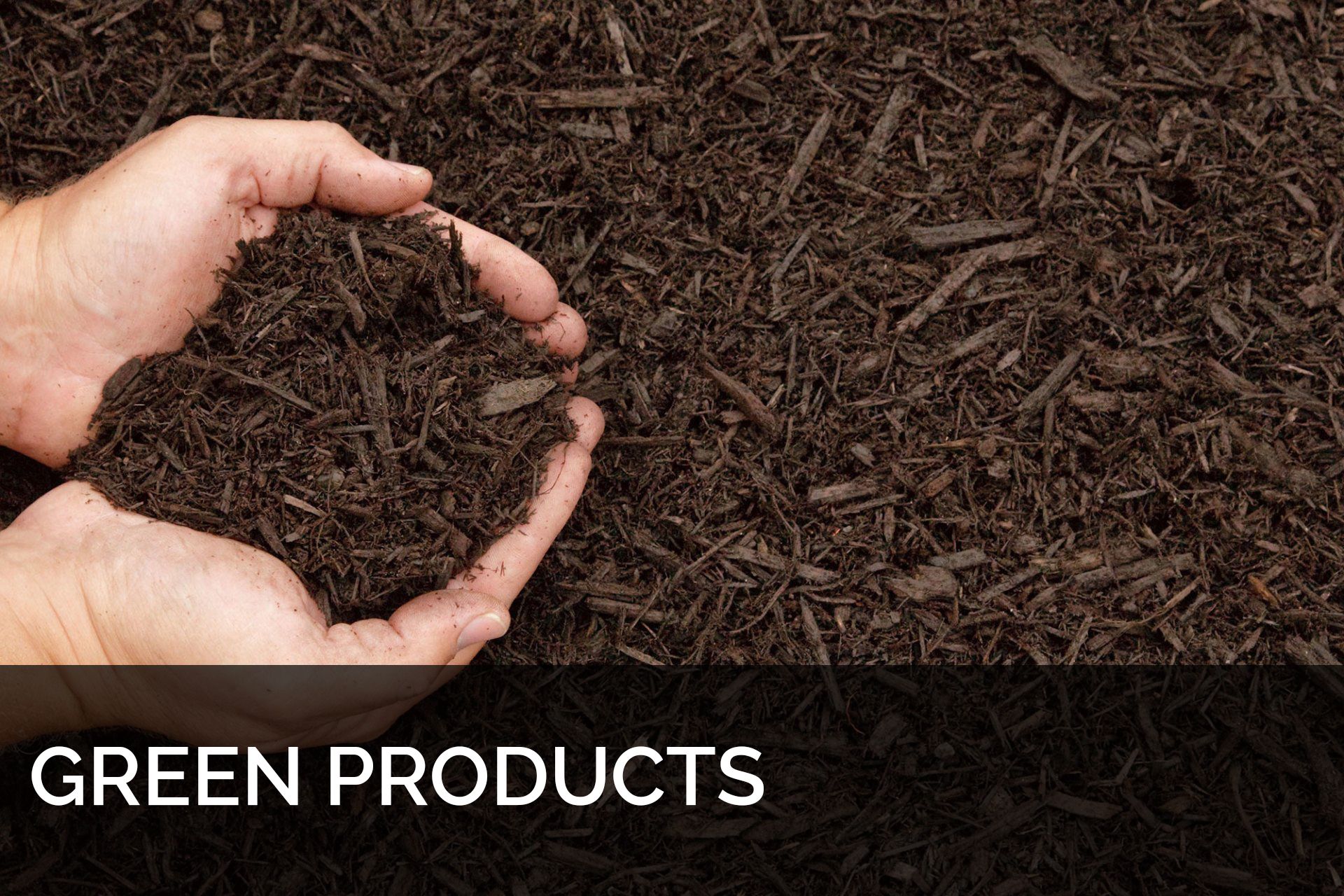 Hand scooping mulch
