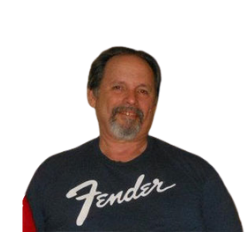 Smiling man in a dark Fender T-shirt against a white background