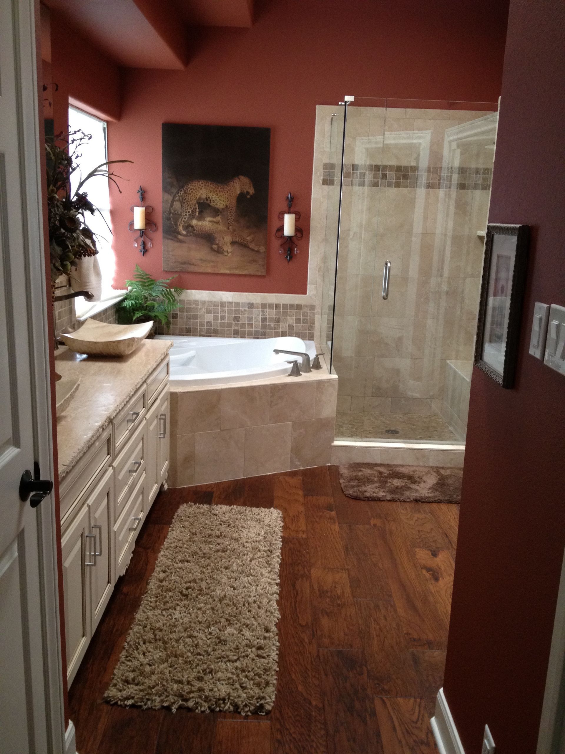 A bathroom with a painting of a horse on the wall
