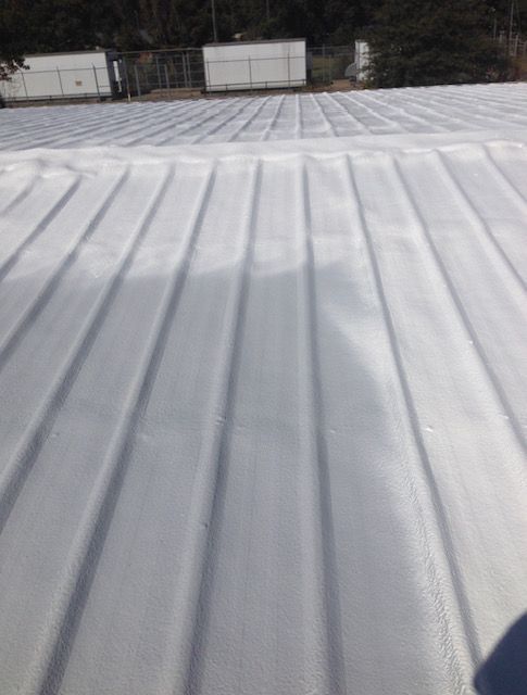 A white silicone roof with a lot of lines on it