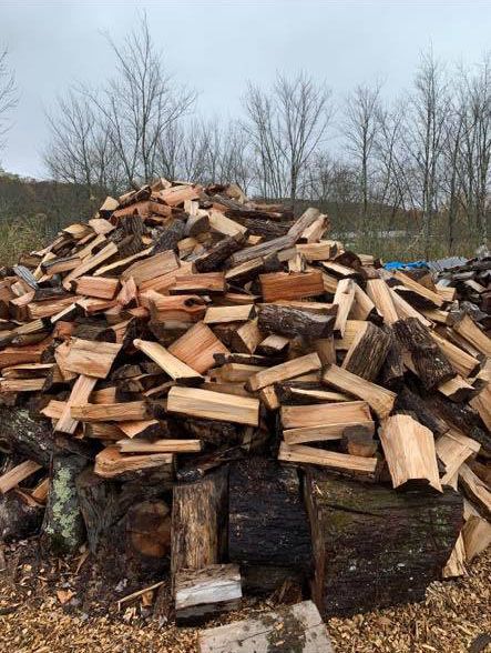 A pile of wood stacked outdoors