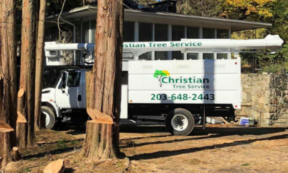 A service truck is parked in front of a house