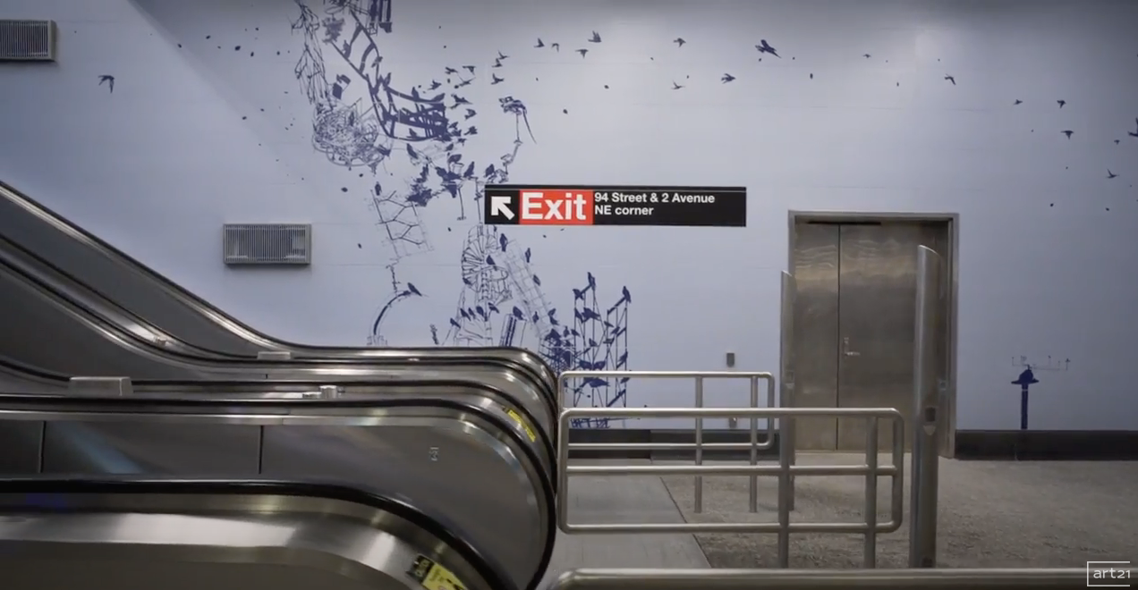 Subway station exit sign above escalators and a closed elevator, with blue wall and metal railing