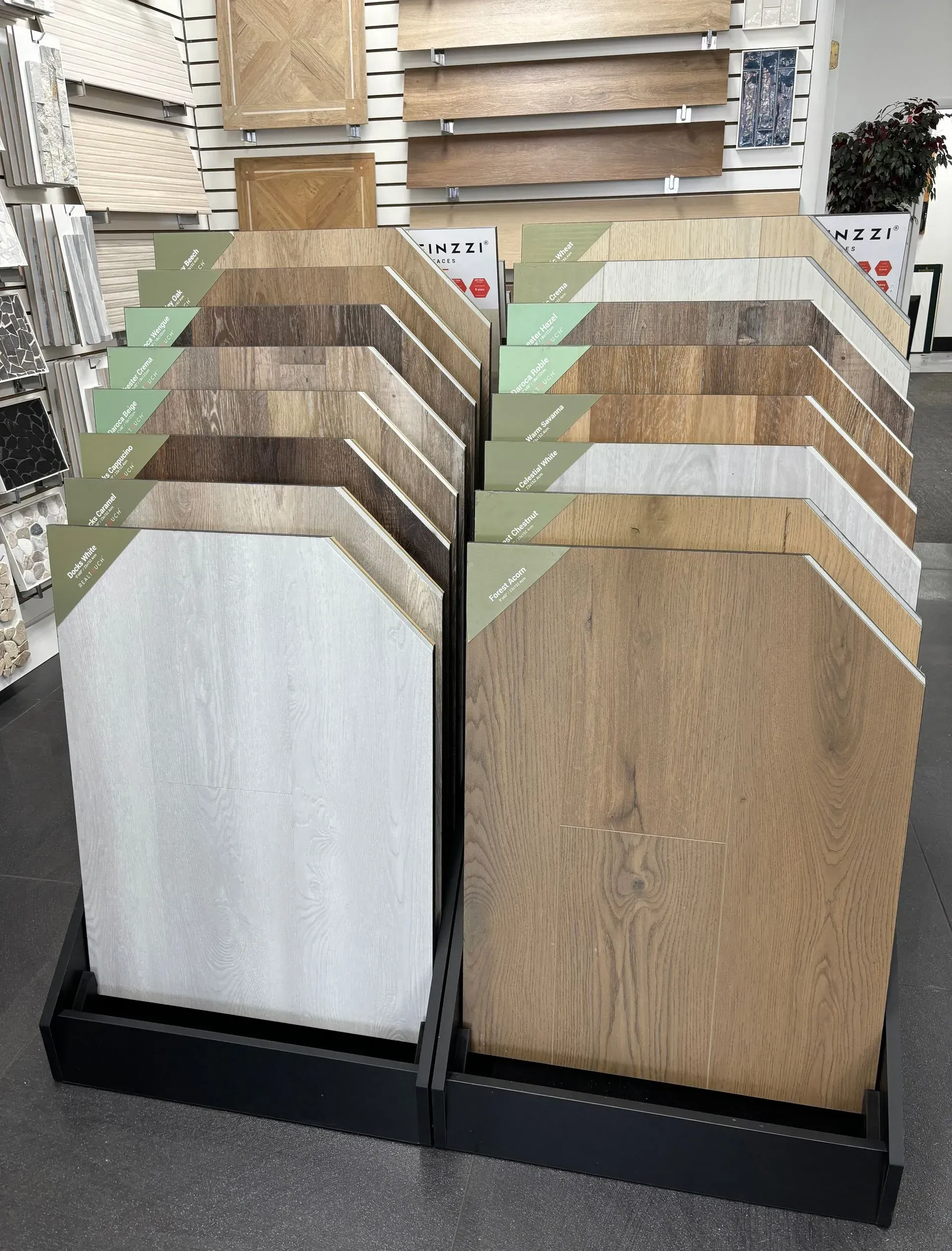 Two freestanding racks of wood and laminate sample boards in a store showroom