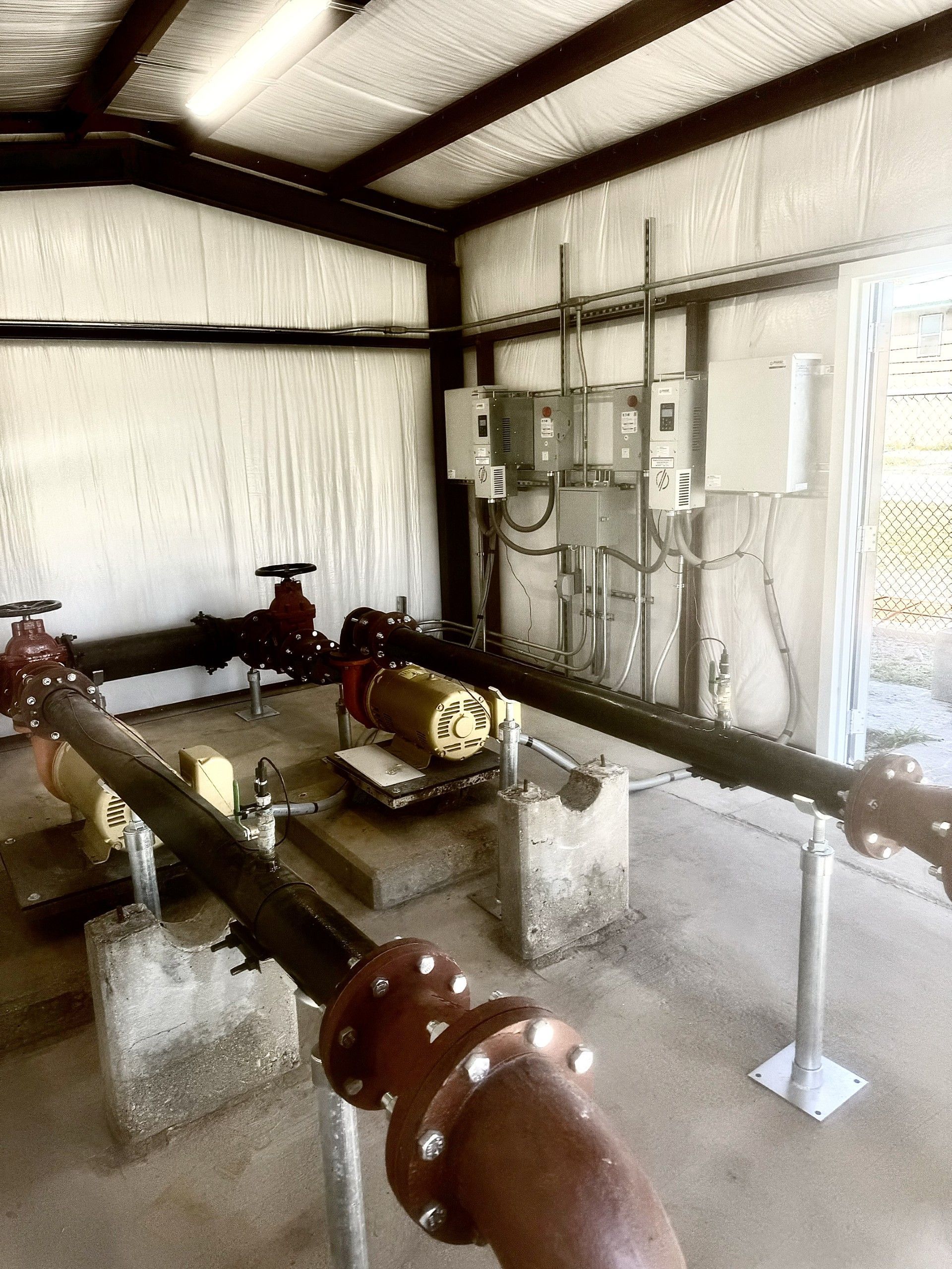 A room with a lot of pipes going through it