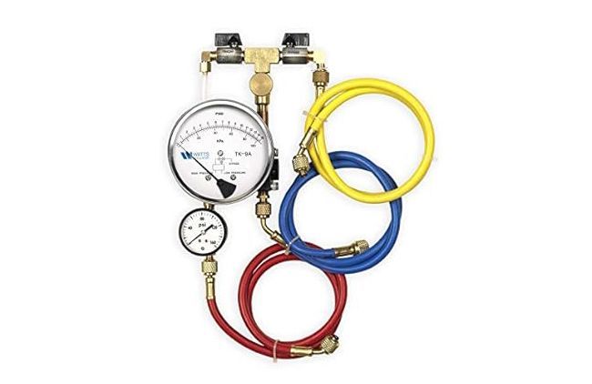 Refrigeration manifold gauge set with gauges, valves, and hoses: blue, red, and yellow.