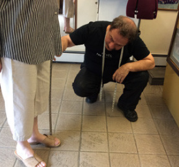 Tailor taking the measurements