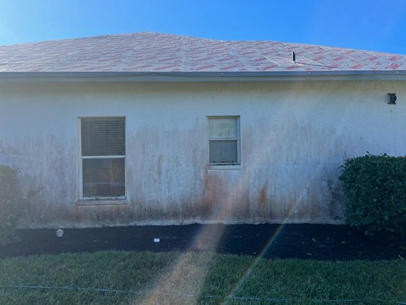 side of house before pressure washing