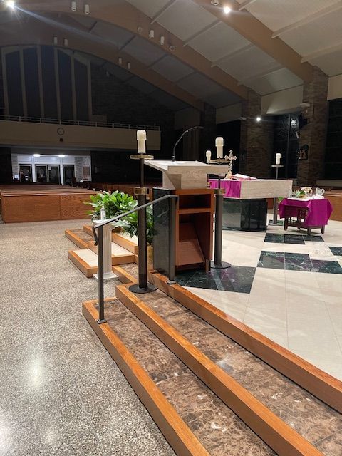 A church with a podium in the middle of it