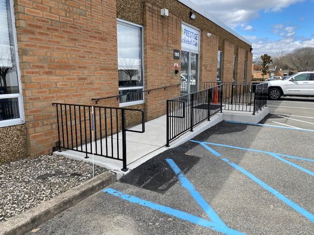 A brick building with a ramp in front of it