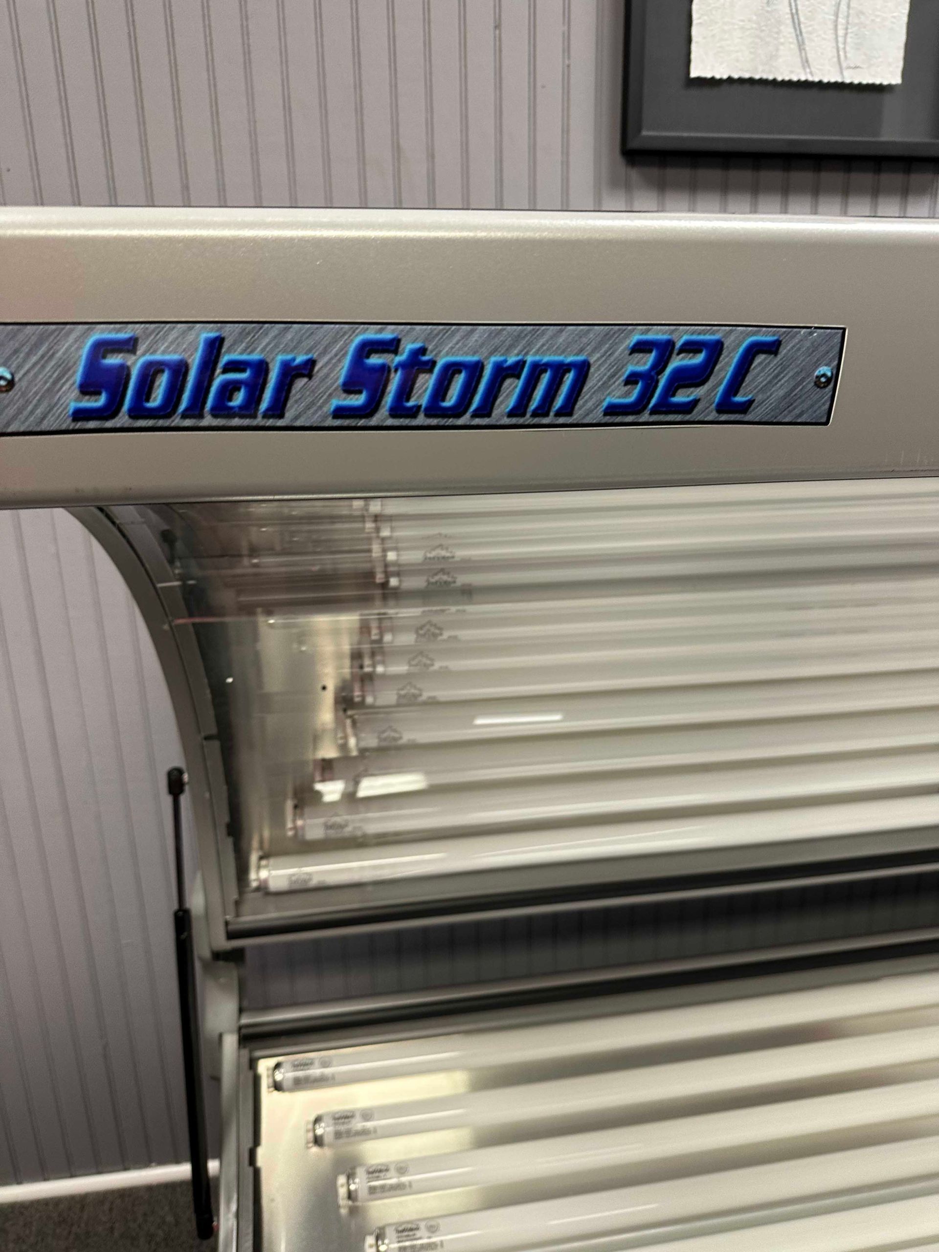 A Solar Storm 32C tanning bed with rows of light bulbs.