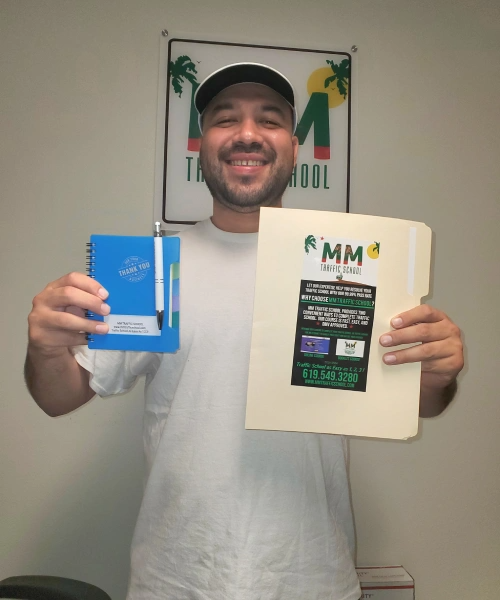 Man in white shirt, cap, smiling, holding notepad and folder with
