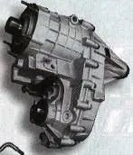 Gray mechanical auto part on a plain background, shown in side view