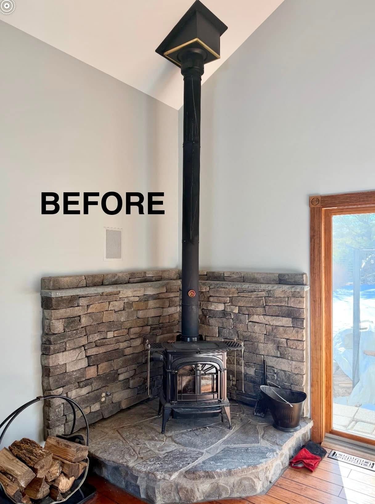 A before picture of a fireplace with a wood stove