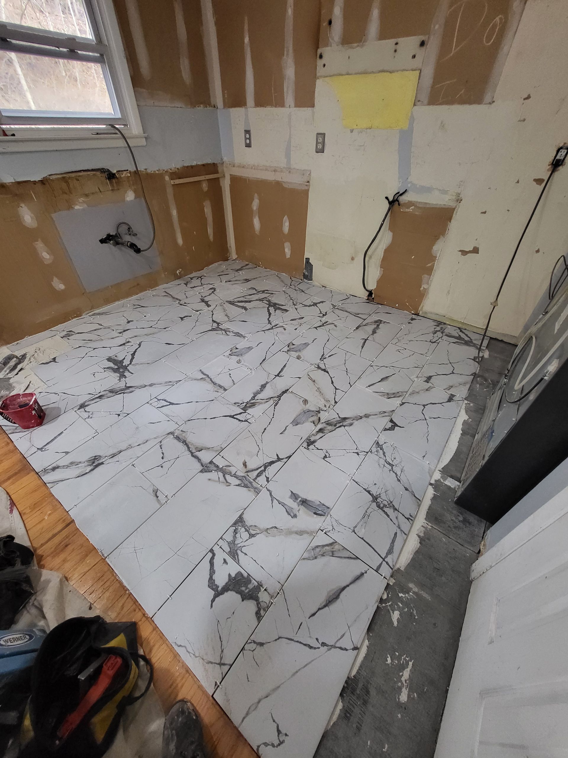 a room with a lot of tiles on the floor