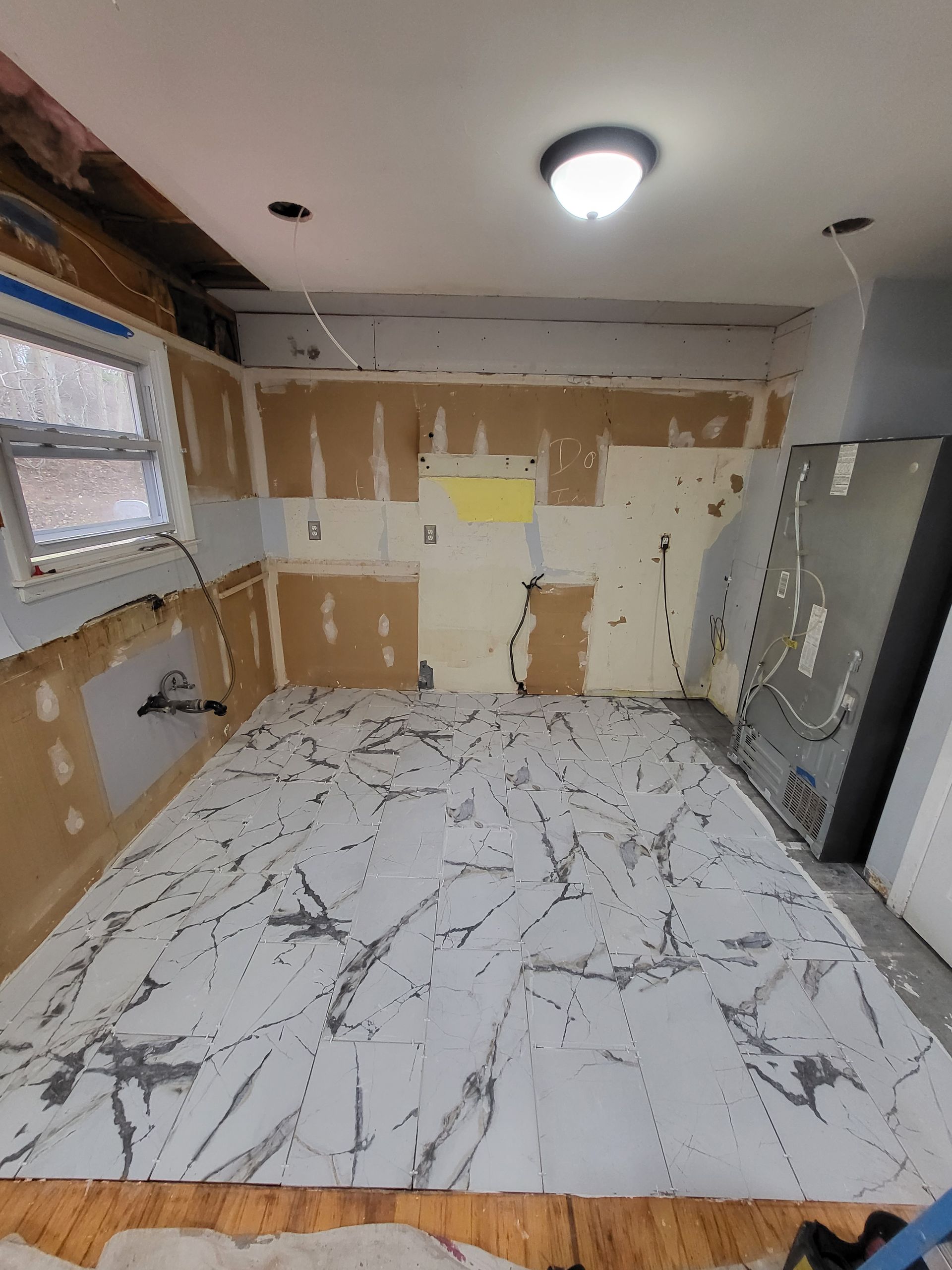 a room with a lot of tiles on the floor and walls