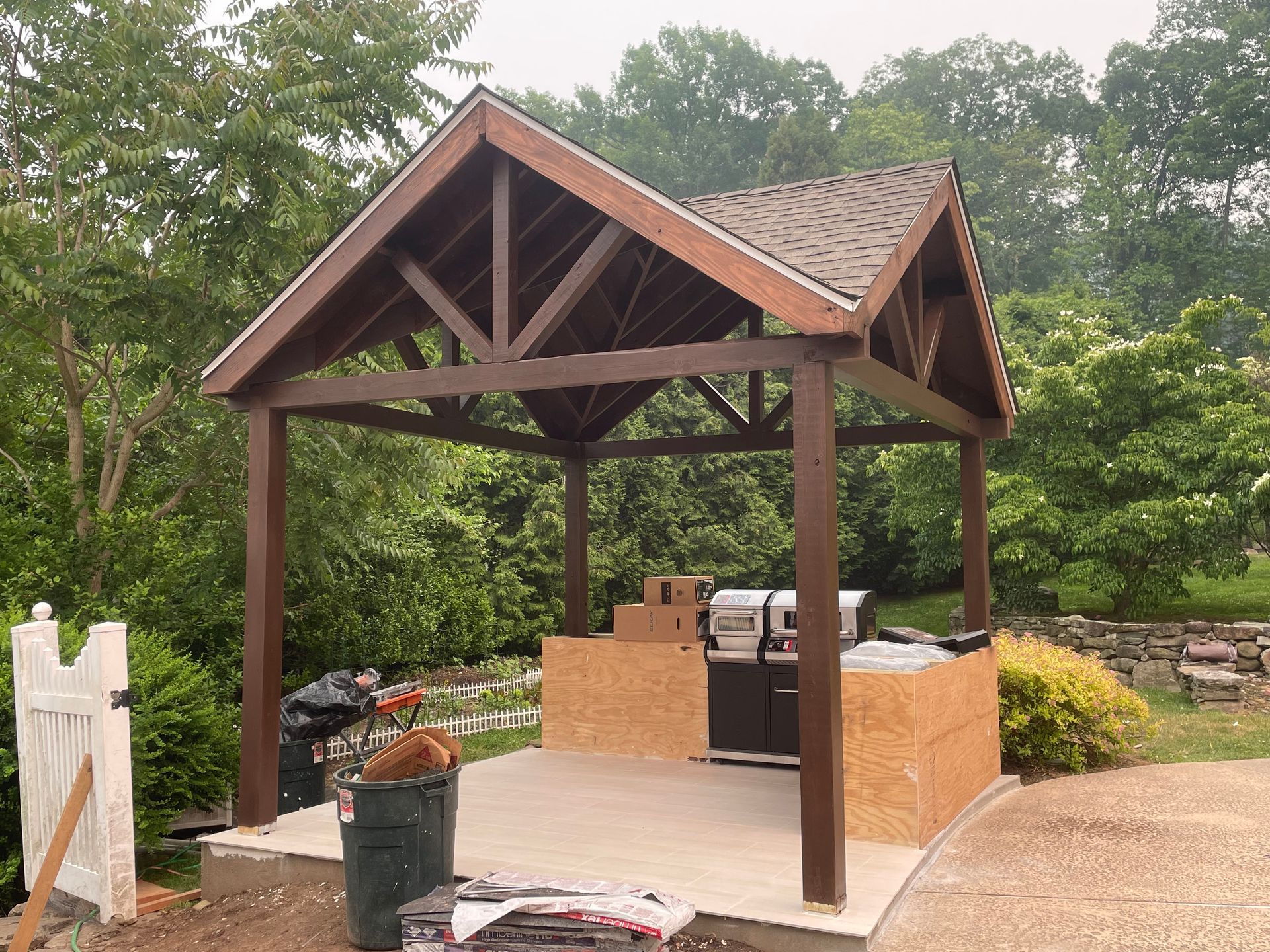 a large wooden structure with a roof is being built