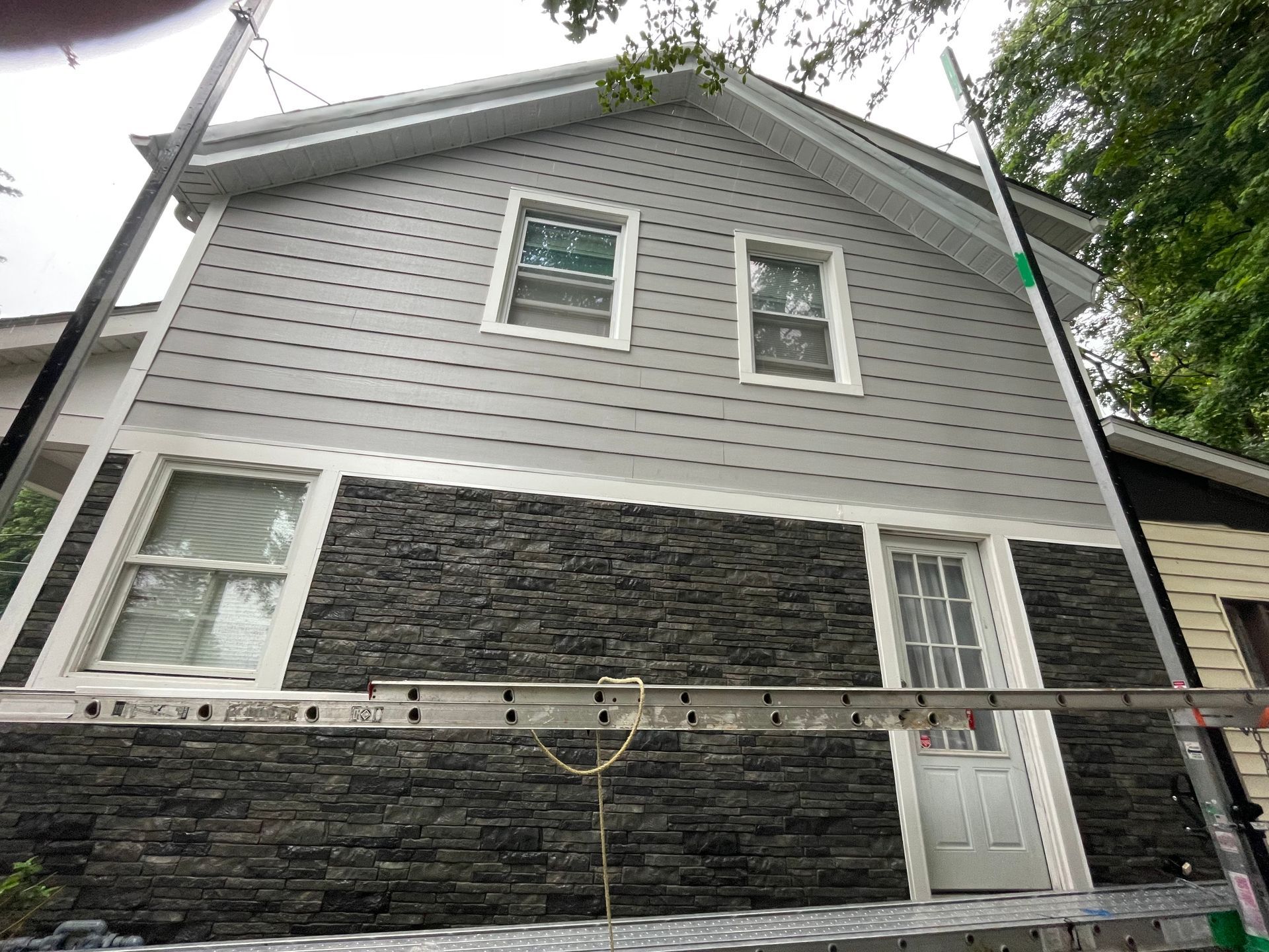 a house with a ladder on the side of it