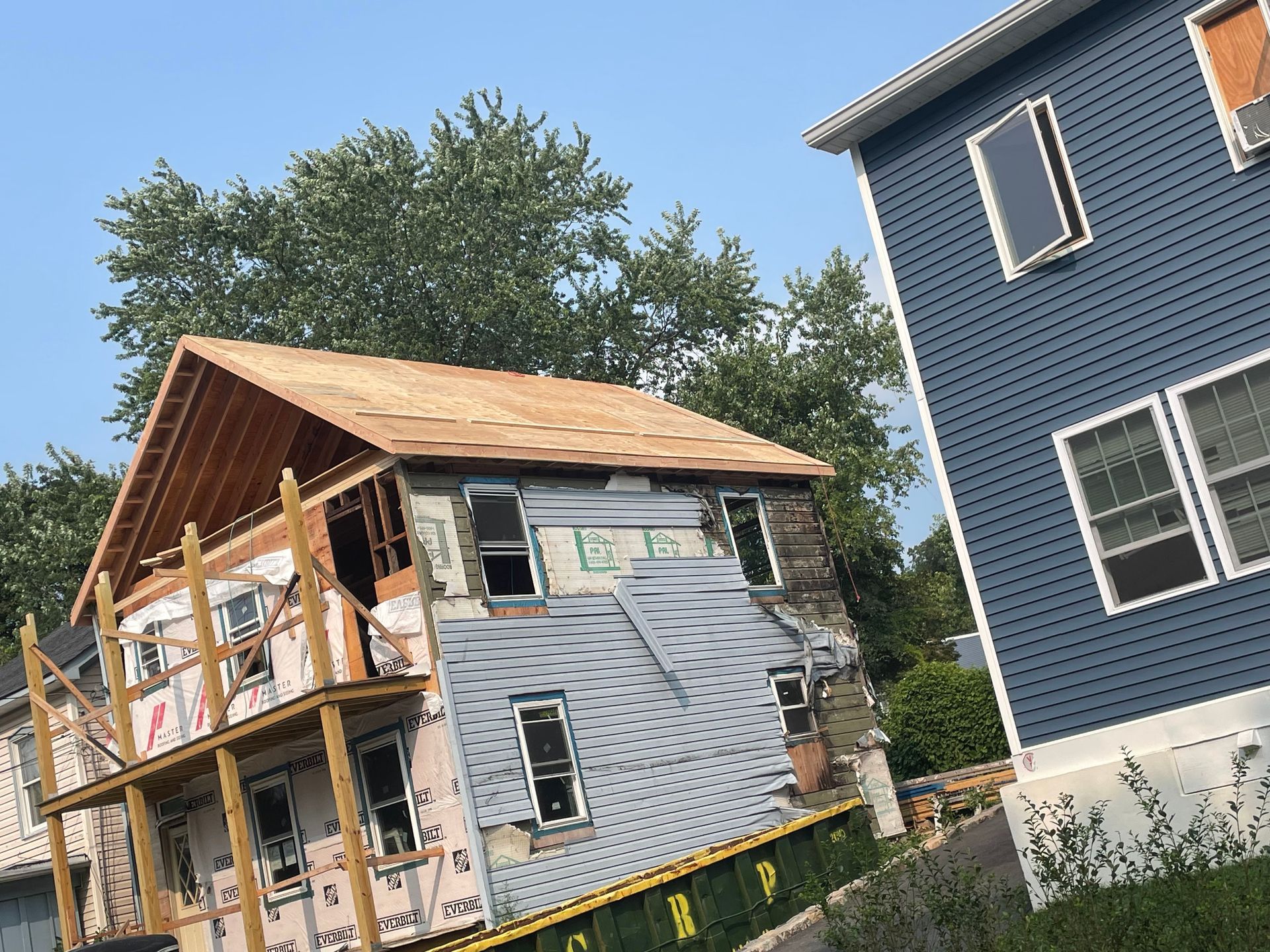 a house is being built next to another house